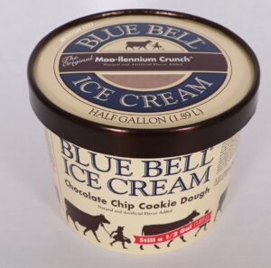 Blue Bell ice cream container showing mismatched packaging with Moo-llennium Crunch lid on Chocolate Chip Cookie Dough carton, creating allergen risk for consumers with tree nut allergies.