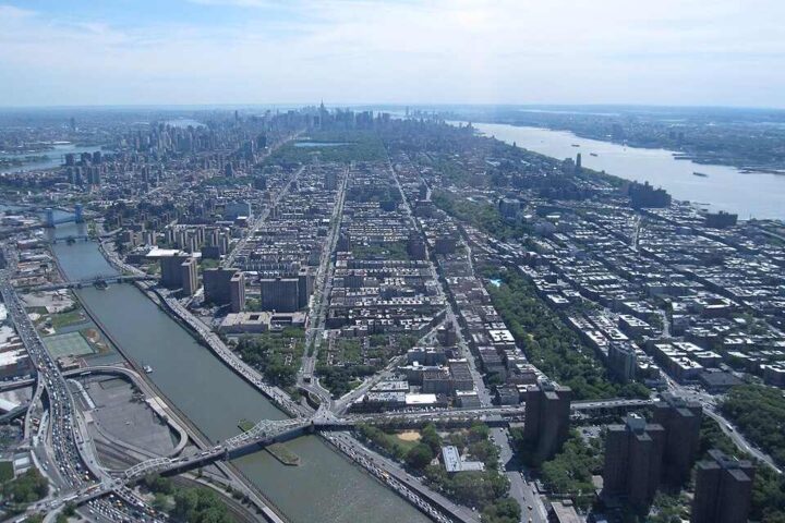 Central Harlem skyline with surrounding streets and river in view, illustrating the neighborhood context relevant to current Legionnaires’ disease updates.