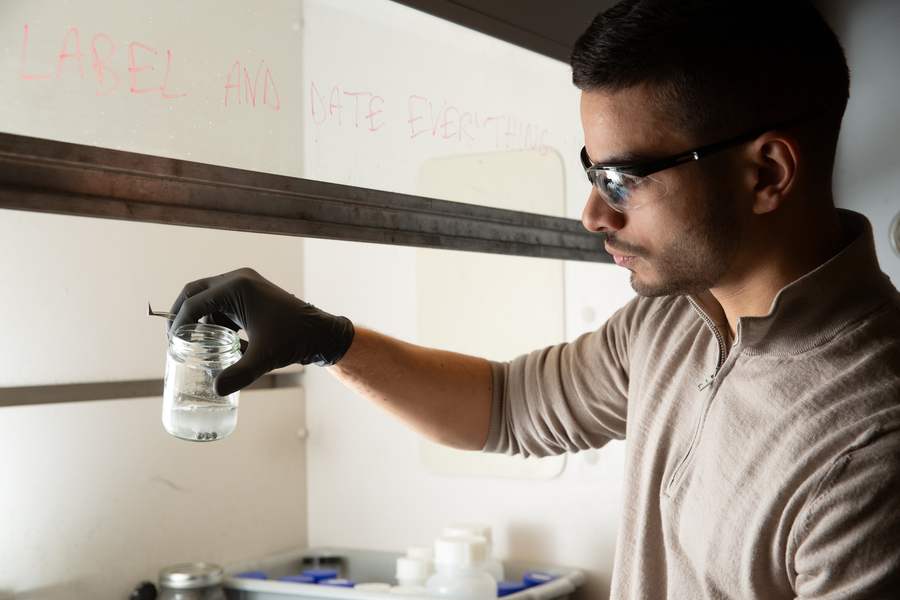 MIT researcher Aly Kombargi demonstrating the aluminum-seawater reaction that produces hydrogen gas, a cornerstone of sustainable energy technology.