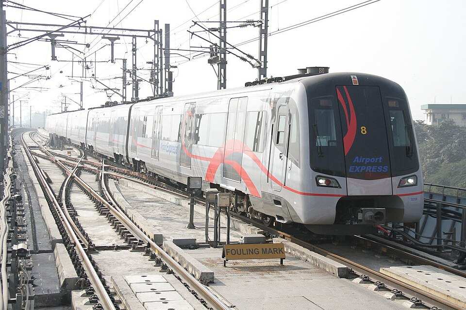 Delhi Metro Airport Express train on elevated tracks, representing urban connectivity and fare revisions in 2025.