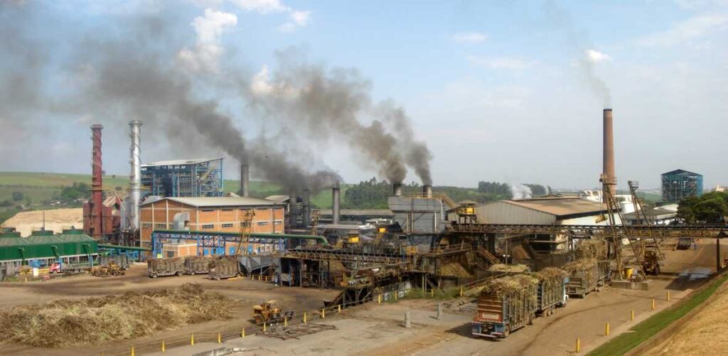 Representative Image. Panoramic view of the Costa Pinto sugar and ethanol industrial plant in Piracicaba, Brazil, showing factory buildings with smokestacks emitting smoke in an industrial setting.