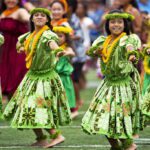 Young women in Hawaii performing traditional hula, used as a symbolic representation in a feature on WalletHub’s 2025 U.S. women’s equality rankings.