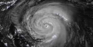 Satellite image of Hurricane Erin showing a well-defined eye surrounded by spiraling cloud bands, captured by NOAA GOES satellite on August 20, 2025.