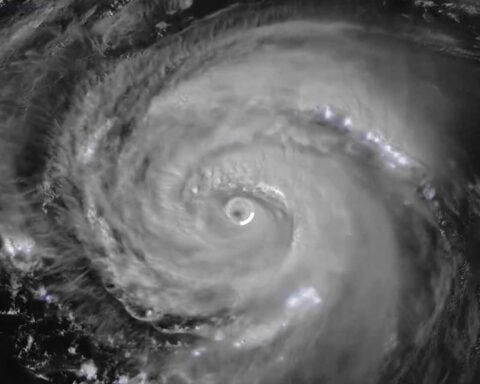 Satellite image of Hurricane Erin showing a well-defined eye surrounded by spiraling cloud bands, captured by NOAA GOES satellite on August 20, 2025.