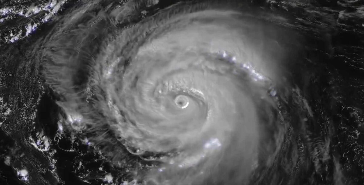 Satellite image of Hurricane Erin showing a well-defined eye surrounded by spiraling cloud bands, captured by NOAA GOES satellite on August 20, 2025.