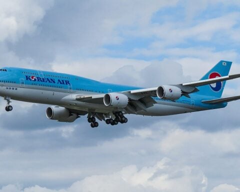 Korean Air Boeing 747-8 aircraft with blue and white livery landing at Frankfurt Airport.