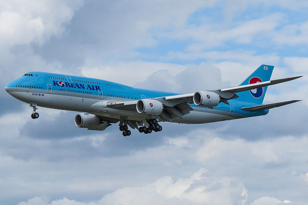 Korean Air Boeing 747-8 aircraft with blue and white livery landing at Frankfurt Airport.