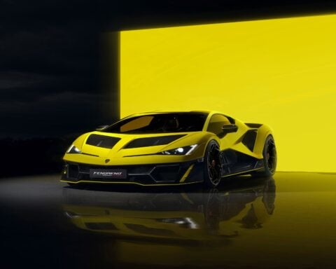 Yellow Lamborghini Fenomeno hypercar with angular design and distinctive black accents displayed against a matching yellow background, highlighting its aggressive aerodynamic styling and low-slung profile.
