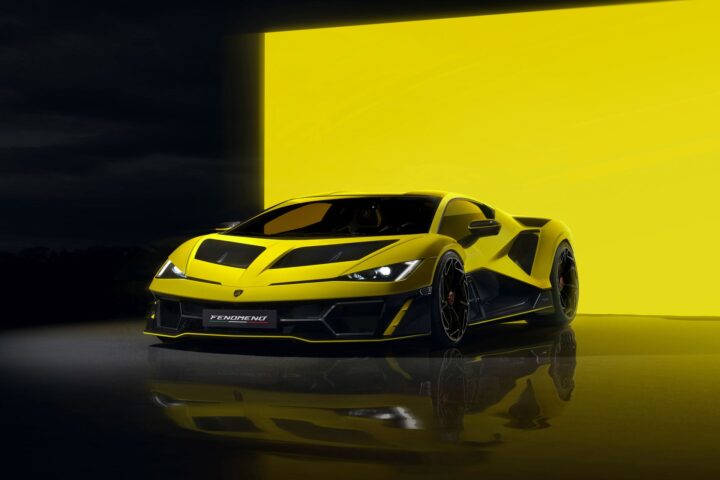 Yellow Lamborghini Fenomeno hypercar with angular design and distinctive black accents displayed against a matching yellow background, highlighting its aggressive aerodynamic styling and low-slung profile.