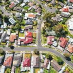 Aerial view of Melbourne residential neighborhood with rows of houses and streets, representing housing affordability and first home buyer policy changes in Australia.