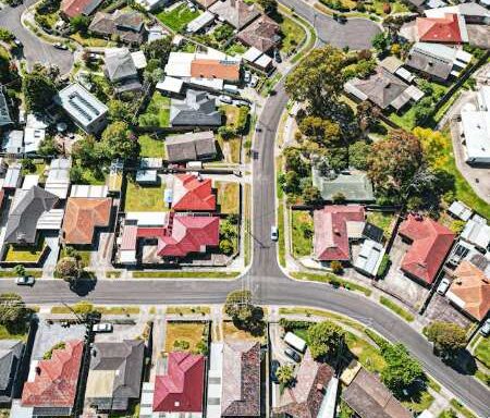 Aerial view of Melbourne residential neighborhood with rows of houses and streets, representing housing affordability and first home buyer policy changes in Australia.