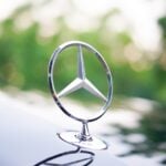 Mercedes-Benz CEO Ola Källenius addresses industry leaders during an automotive policy forum.