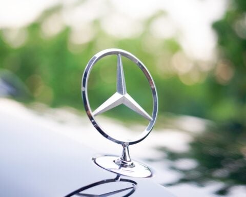 Mercedes-Benz CEO Ola Källenius addresses industry leaders during an automotive policy forum.