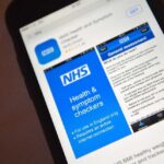 iPhone 6 showing Apple App Store search results for NHS, with NHS Health and Symptom Checkers app listing, GET button visible, and partial NHS BMI healthy weight calculator listing.