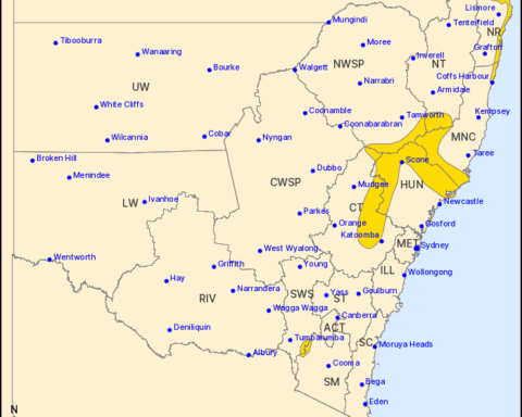 Map of New South Wales showing regions under severe weather warning for damaging winds and heavy rainfall.