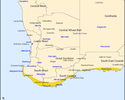 Map of southern Western Australia showing the coastal belt from Kalbarri down to Esperance shaded under a severe-weather warning for damaging winds.