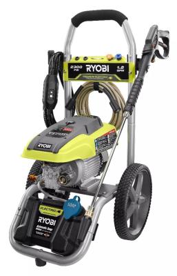 Ryobi electric pressure washer model RY142711VNM with green and black color scheme, featuring a detergent tank with blue cap and spray nozzle attachment on wheels.
