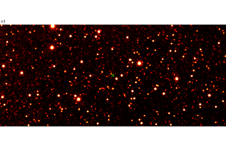 Infrared SPHEREx image showing interstellar comet 3I/ATLAS as a bright red-orange point among many fainter stars on a black background; the object is marked for reference.