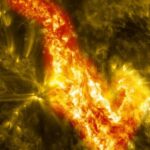 Solar surface close-up showing bright active region with flares and prominences