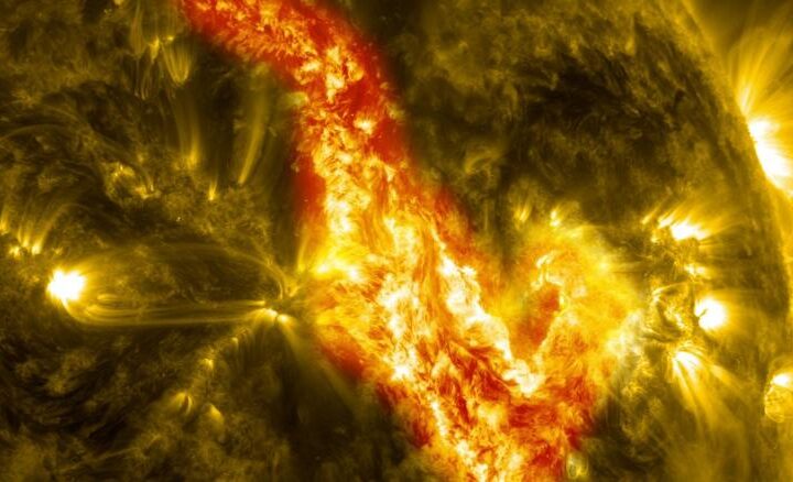 Solar surface close-up showing bright active region with flares and prominences