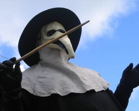 Historical depiction of bubonic plague protection methods including herbal nose filters and touch-avoidance tools