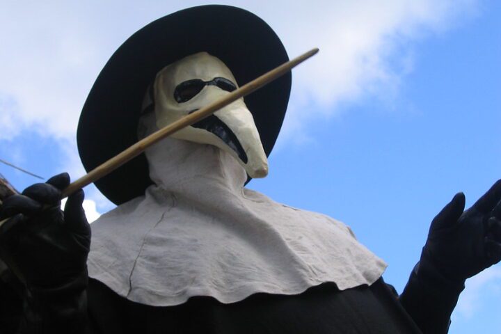 Historical depiction of bubonic plague protection methods including herbal nose filters and touch-avoidance tools