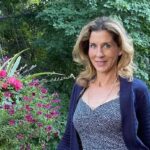 Portrait of Monica Seles, looking at the camera, neutral background.