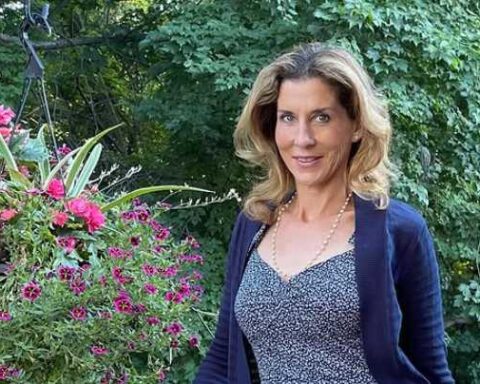 Portrait of Monica Seles, looking at the camera, neutral background.
