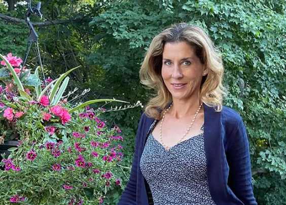 Portrait of Monica Seles, looking at the camera, neutral background.