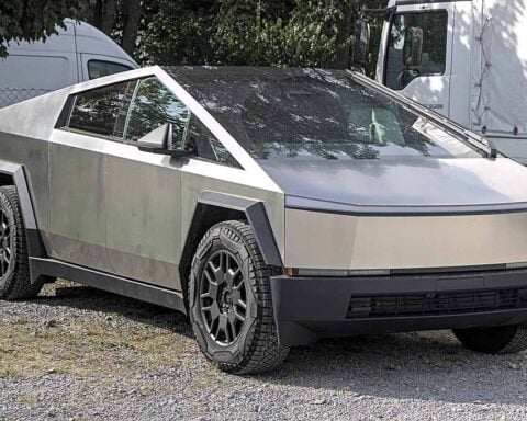 2024 Tesla Cybertruck Foundation Series parked outdoors with stainless steel body and off-road tires