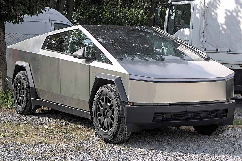 2024 Tesla Cybertruck Foundation Series parked outdoors with stainless steel body and off-road tires