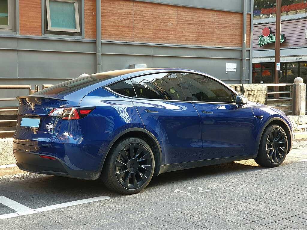 Tesla Model Y Dual Motor Deep Blue Metallic SUV parked outdoors