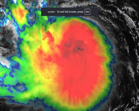 GOES-19 satellite image of Tropical Storm Erin with intense central convection and spiral rainbands over the Atlantic.