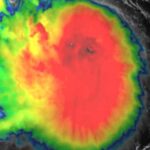 GOES-19 satellite image of Tropical Storm Erin with intense central convection and spiral rainbands over the Atlantic.