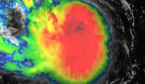 GOES-19 satellite image of Tropical Storm Erin with intense central convection and spiral rainbands over the Atlantic.