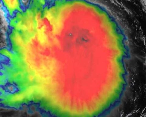 GOES-19 satellite image of Tropical Storm Erin with intense central convection and spiral rainbands over the Atlantic.