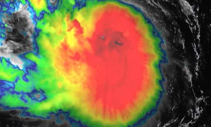 GOES-19 satellite image of Tropical Storm Erin with intense central convection and spiral rainbands over the Atlantic.