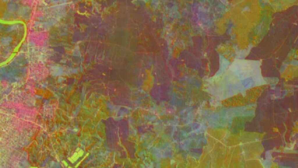 Animated globe showing two colored orbital tracks and a vertical swath of false-color embedding pixels across Earth’s surface.