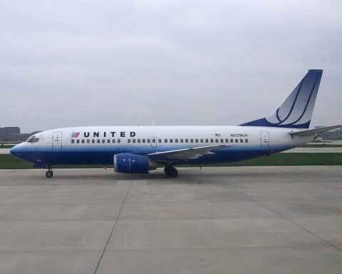 United Airlines Boeing 737-800 parked on airport tarmac,