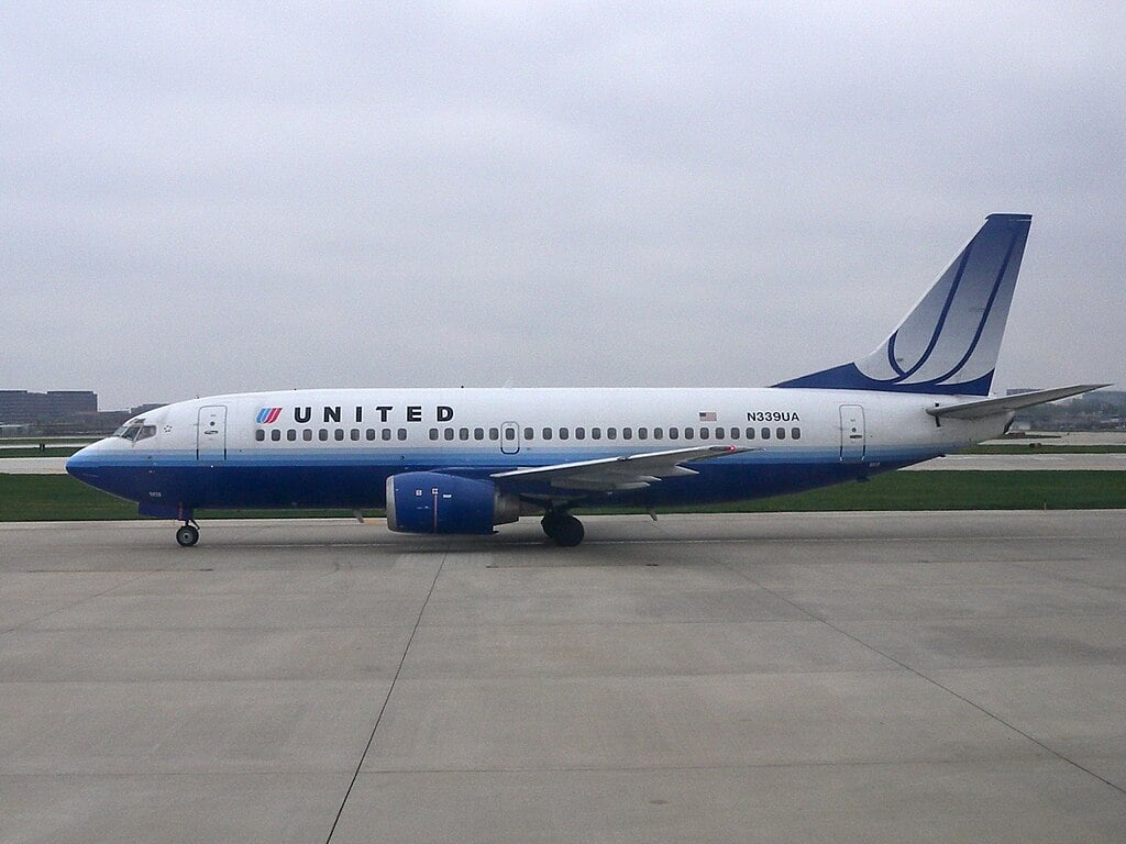 United Airlines Boeing 737-800 parked on airport tarmac,
