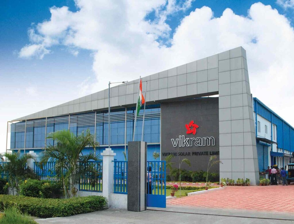 Alt Text: Vikram Solar corporate headquarters building with national flag at entrance