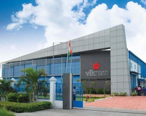Alt Text: Vikram Solar corporate headquarters building with national flag at entrance