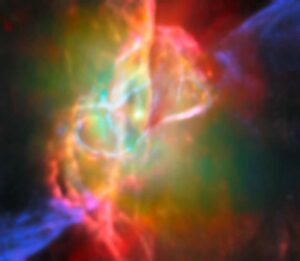 Colorful infrared image of the Butterfly Nebula's center showing a bright central star surrounded by greenish nebulosity and looping structures in cream, orange, and pink colors, captured by Webb telescope and ALMA.