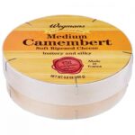 Round wooden box of Wegmans Medium Camembert Soft Ripened Cheese with French origin label and red cave-ripened seal