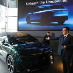 Zeekr executive unveiling the Zeekr 7X at an Australian launch event.