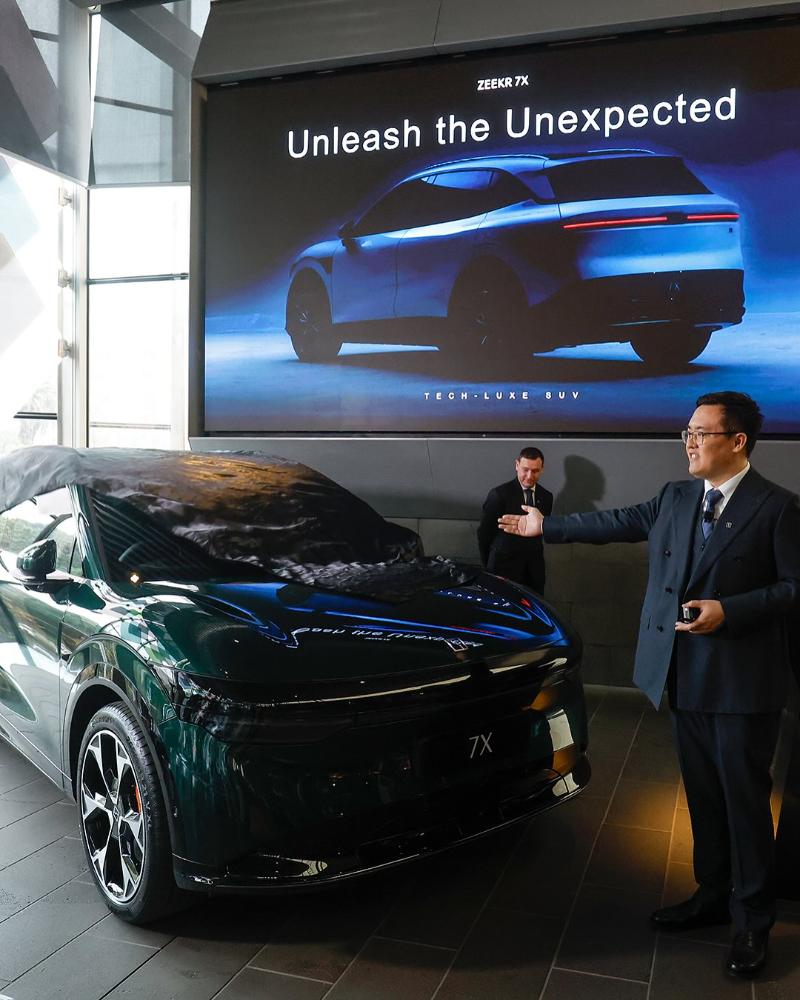 Zeekr executive unveiling the Zeekr 7X at an Australian launch event.