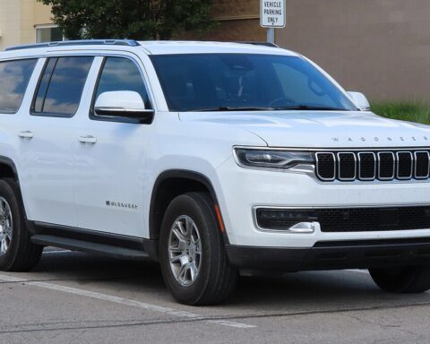 White 2022 Jeep Wagoneer Series I SUV parked on a street, showing front right angle view of the luxury vehicle affected by recent safety recalls.