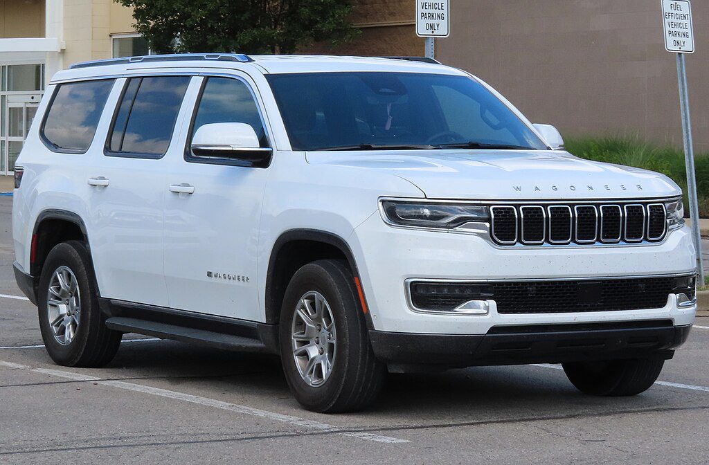 White 2022 Jeep Wagoneer Series I SUV parked on a street, showing front right angle view of the luxury vehicle affected by recent safety recalls.
