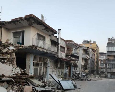 Representative Image. Severely damaged residential buildings in Hatay Province, Turkey, with collapsed walls, exposed interiors, and debris scattered across the street following the 7.8 magnitude earthquake