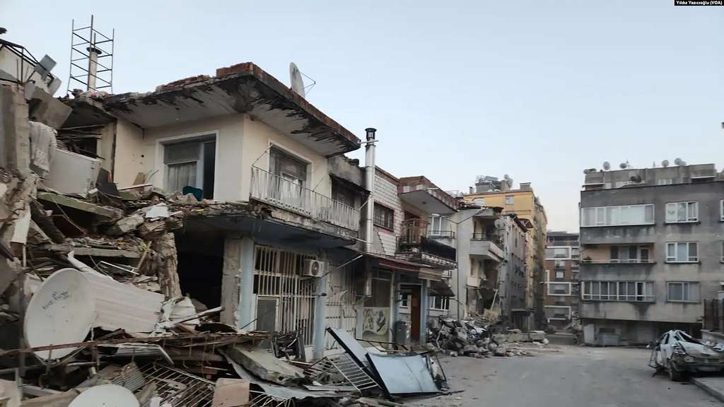 Representative Image. Severely damaged residential buildings in Hatay Province, Turkey, with collapsed walls, exposed interiors, and debris scattered across the street following the 7.8 magnitude earthquake